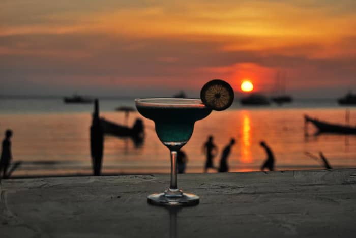 Sex on the Beach is a cocktail made with vodka, peach schnapps, Chambord, orange juice, and cranberry juice.