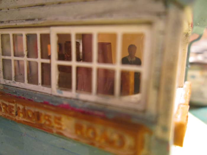 The 'bobby' is where he belongs, in his one-man cabin near the junction with the Down Main. The years have been unkind to this 'Warehouse Road' nameboard since Nationalisation...