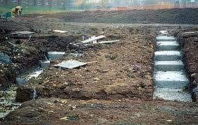 Stepped foundations, when the ground is not flat it is necessary to lay the foundations with steps in them, so that the foundations are level for the bricklayers to lay bricks on them. See the picture this is a typical way of laying the foundations.