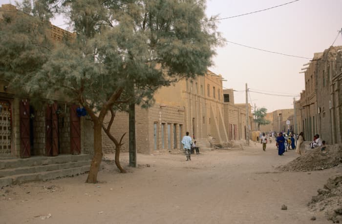 A street scene in the dry and dusty Timbuktu, the famous town at the terminus of the ancient caravan route linking the Mediterranean with West Africa