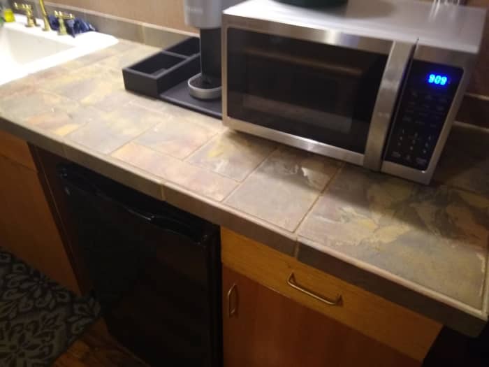 A picture of a small microwave and fridge in the room. These are beneficial if you're wanting to save money. Bringing a couple of half gallons of milk is much cheaper than buying from the inn restaurant.