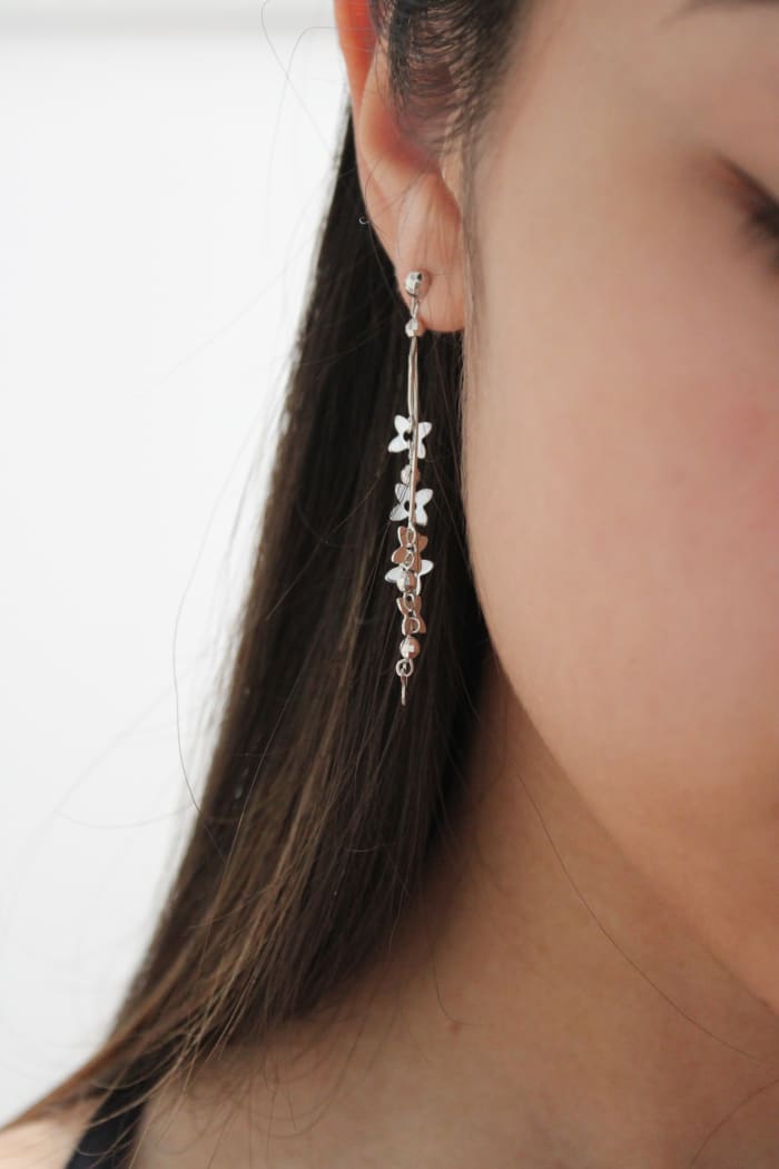 Silver jewelry with little jewels in pretty colors is ideal for Pisces. Dangly earrings like in this picture do give off the water sign's vibe.