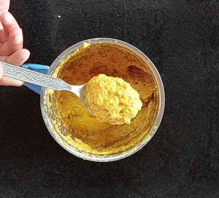 Add 1/2 cup water, close the lid and grind to a fine paste. This is the masala for the sambar. Set aside.