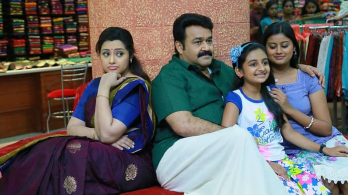 Drishyam is the story of a cable-TV network owner Georgekutty (Mohanlal) who lives with his wife and two daughters in a remote town in Kerala India.