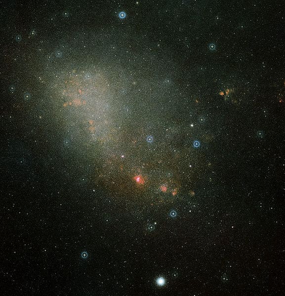 The two-color image shows an overview of the full Small Magellanic Cloud (SMC) and was composed from two images from the Digitized Sky Survey 2. The field of view is slightly larger than 3.5 × 3.6 degrees.