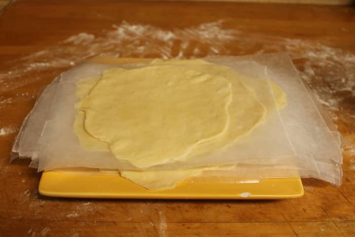 To prevent the shells from sticking to each other, you can separate them with wax paper as you stack them on a plate.