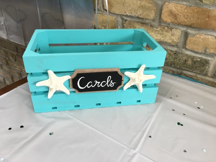 Amber painted the card box and added the decoative touches to carry on the beach theme and color scheme!