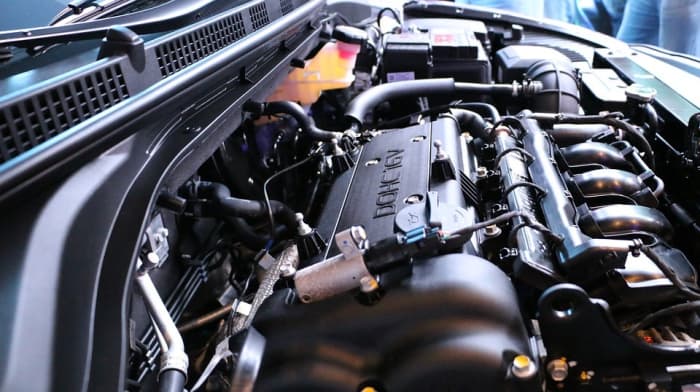 Car engine coolant is a special chemical that protects your car's engine by keeping it at the right temperature. When you add it to the radiator, it absorbs heat from the engine and carries it away. This keeps your engine from overheating, which can
