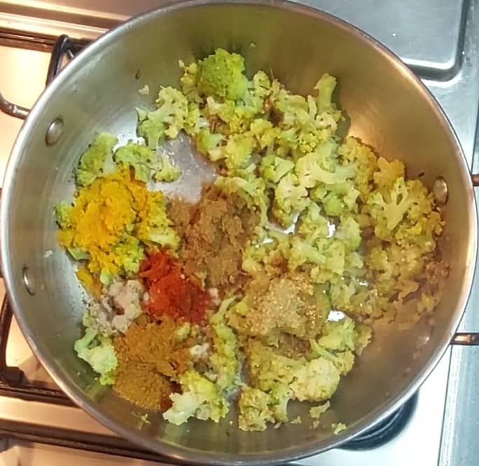 Add 1/2 teaspoon red chili powder, 1 teaspoon coriander powder, 1/2 teaspoon cumin powder,1/2 teaspoon turmeric powder, 1/2 teaspoon dry mango powder and 1/2 teaspoon garam masala powder. Mix well.