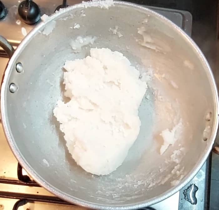 Mix well over low flame and stir continuously till it forms a single mass. Break lumps if any. Switch off the flame.