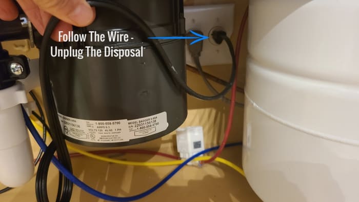Turn off the wall switch and either unplug the disposal before using the hex key, or turn off the breaker.