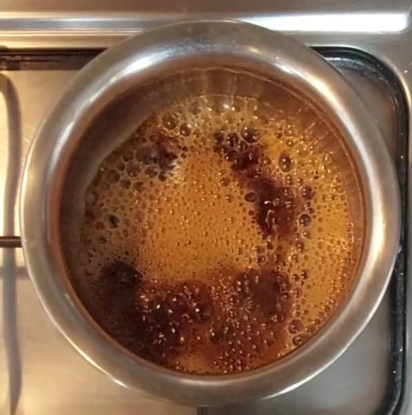 In a vessel, add 1 cup of jaggery and 1/2 cup water. Cook till jaggery dissolves completely; then switch off the flame.