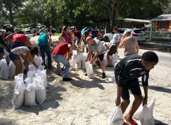 These people are getting ready for the oncoming hurricane. Now, this may sound confusing, but the name of Puerto Rico means a rich port, but today those people over there are not that rich, so, they need some outside help after the hurrinane damage.