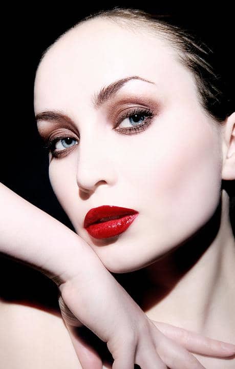 Go for the drama for that special night out on the town with dark smokey eyes and ruby red lips. The blush is very pale to highlight the skin tone and not compete with the heavy eye and lip colors.