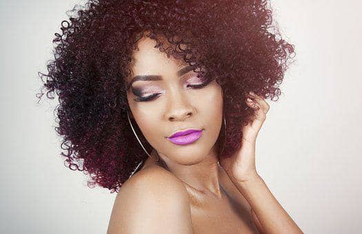 Notice how the violet colors enhance her eyes and lips to create a monochromatic effect. Her cheeks are kept light and neutral to avoid a clownish look.