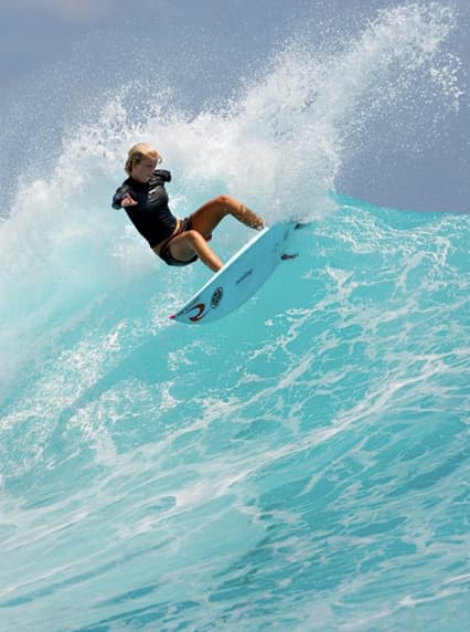 Bethany Hamilton-13 yr old girl who lost her arm to a shark attack return to the waves less than a month after the accident.