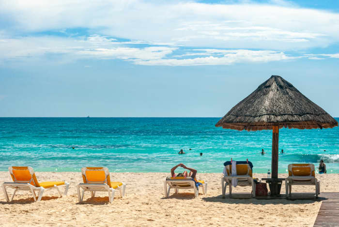 Designate part of your budget as money to be put in savings that you will not touch until your goal, such as an island vacation, is reached.