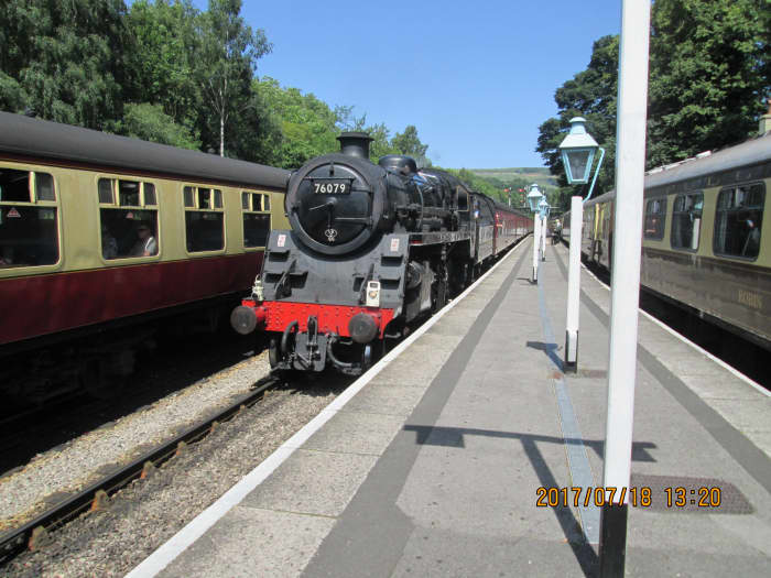 At Grosmont at the northern end of the NYMR before it joins with the line via Glaisdale from Battersby, a preserved British Railways' Standard 2-6-0 brings in a train from Whitby over the junction