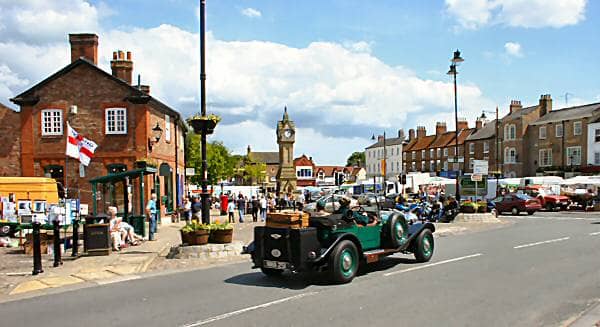 Classic start. How about setting out from Thirsk Market Square in a convertible sports car in British Racing Green? Turning left, left again, right and right and right again gets you to the roundabout where you follow the road for Sutton Bank