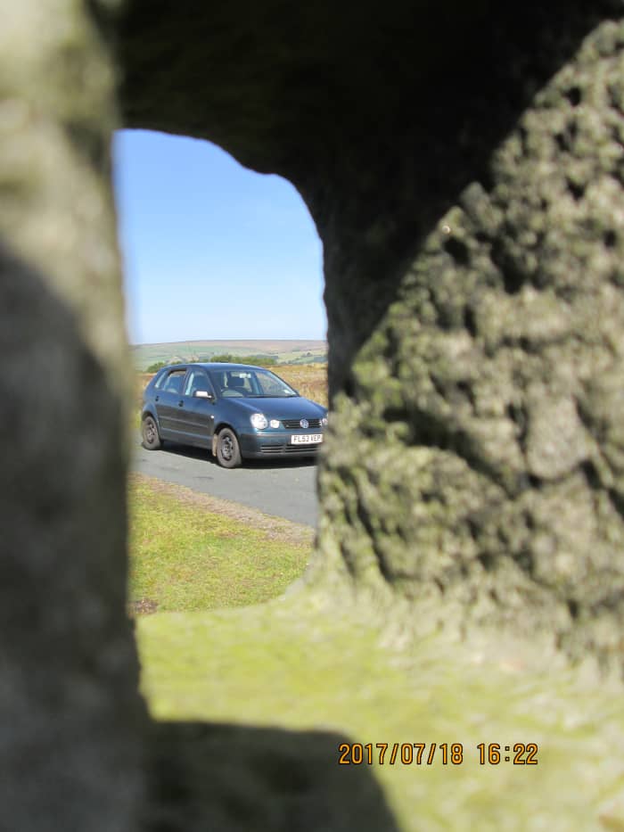 'Modus operandi', the means of transport I've been using, my elder daughter Joanne's 2003 VW Polo seen in the 'keyhole' of one of the waymarkers.