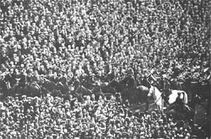 The lone white horse and policeman sorting out the crowd to allow the game to start.