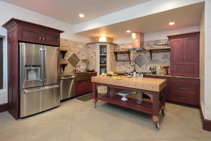 You can have a really pretty kicthen with a cabin or cottage style. The purple-brown cabinets will make your kitchen look new and interesting.