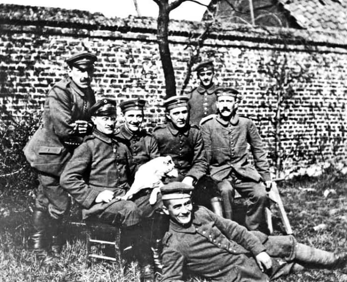 Hitler(on the far-right, sitting) was a devoted and fanatical soldier. He had good relationships with many of his fellow soldiers.
