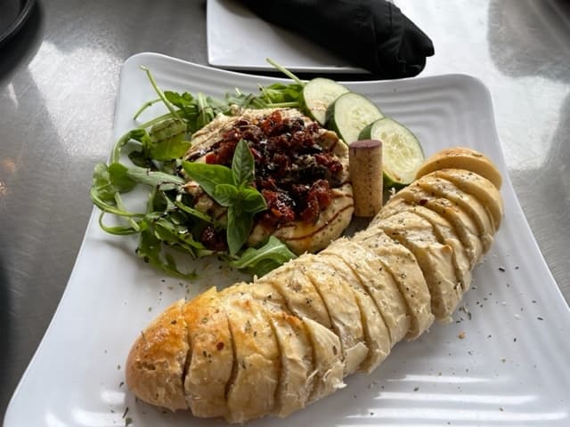 The hummus was fantastic. You can tell they made it in house. The rustic bread paired so well. I felt very fancy drinking my wine and dining on this tasty platter.