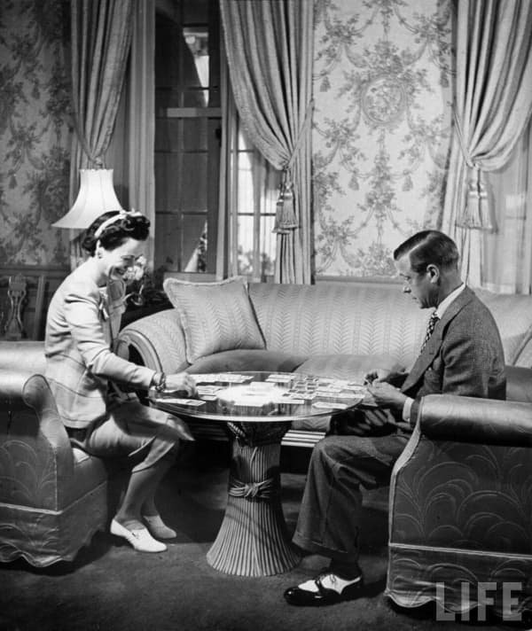 1941, Nassau, Bahamas — The Duke Windsor, and his wife the Duchess, playing a card game in their home. — Photograph by David E. Scherman for LIFE