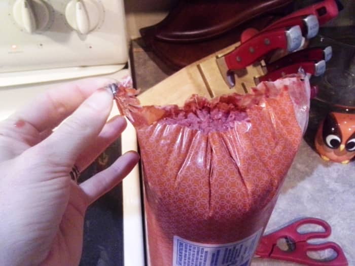 I usually just cut under the metal piece and the whole thing opens up for me.