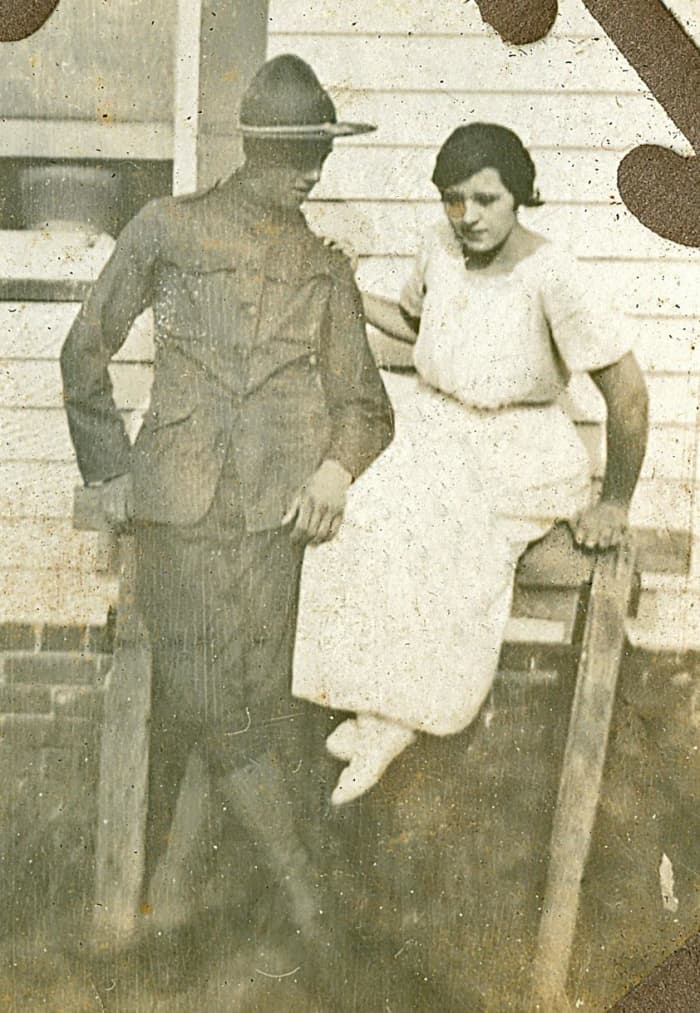 My grandmother Ruth is wearing white slippers in this photo. Her new husband, Clarence McGhee is heading off to France for WWI.
