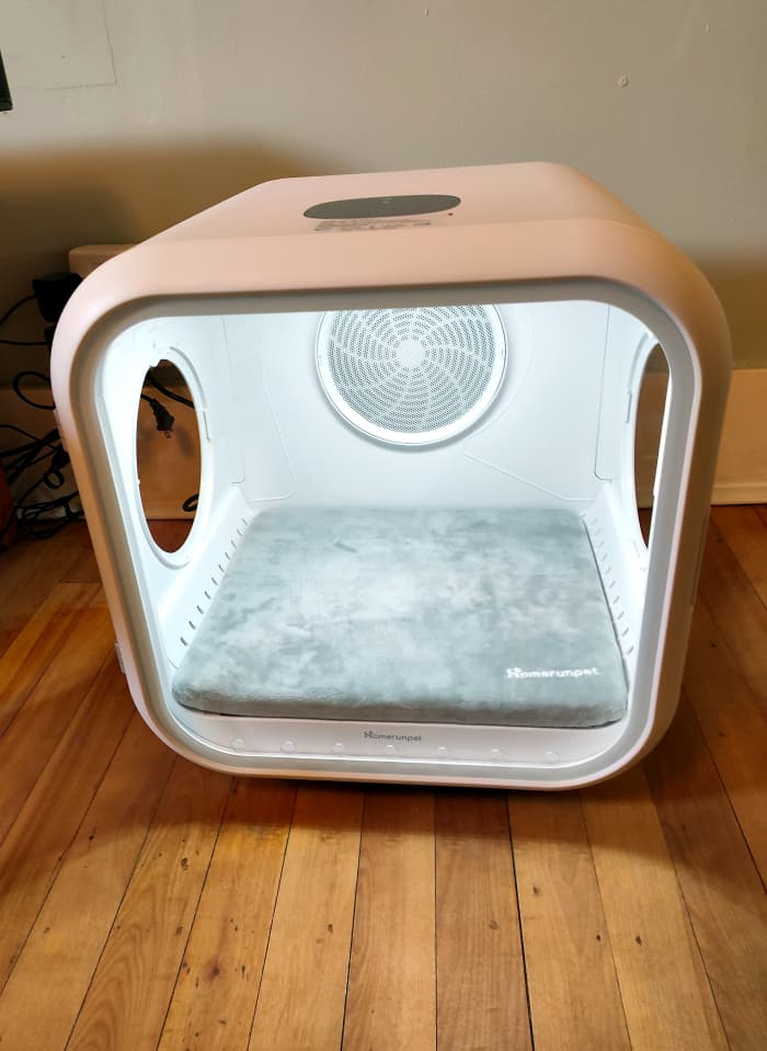 LED light is turned on, displaying a view of the cabin as seen through its glass door