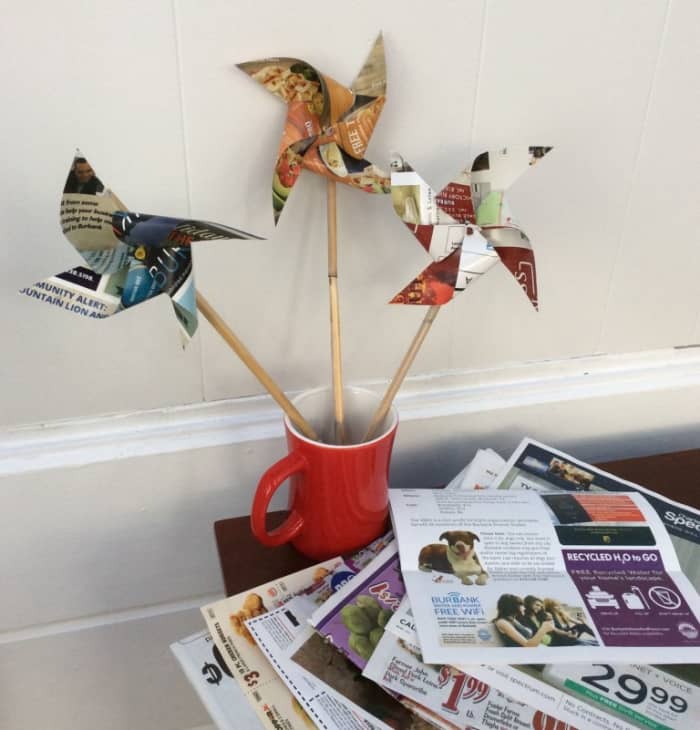 Pinwheels are a fun project to make with your kids. Just use a die cutting machine. Using left over magazines, these pin wheels are fun to make and play with