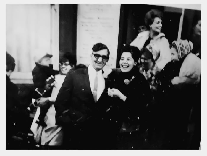 My Auntie Josie marries Uncle Tony, with Auntie Ivy in the background. On the left is my cousin Carole Ardron, carrying her oldest son, Paul Ardron. My cousin Linda is the small child being carried (on the right).