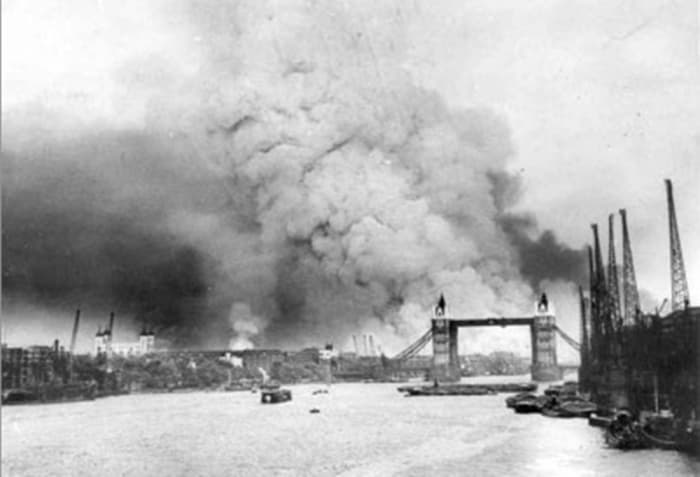 Bombing of Bermondsey and London during the Blitz, showing the aftermath of an air raid over the Thames and Tower Bridge.