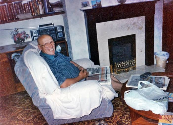 Dad sitting in the dining room in the 1990s - behind him were the book shelves and cabinet that he had made at joinery classes many years earlier. In front of him is the coffee table which he also made.