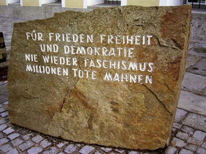 Outside of Hitler's birthplace is a memorial stone with the inscription: "For peace freedom / and democracy / never again fascism / millions of dead remind us" It serves as a sombre reminder of the atrocities committed by Hitler.