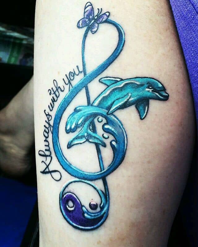 This stunning tattoo design combines the dolphin and the music note wonderfully. Not only does it look amazing, but the music note also symbolizes the dolphin’s playfulness.