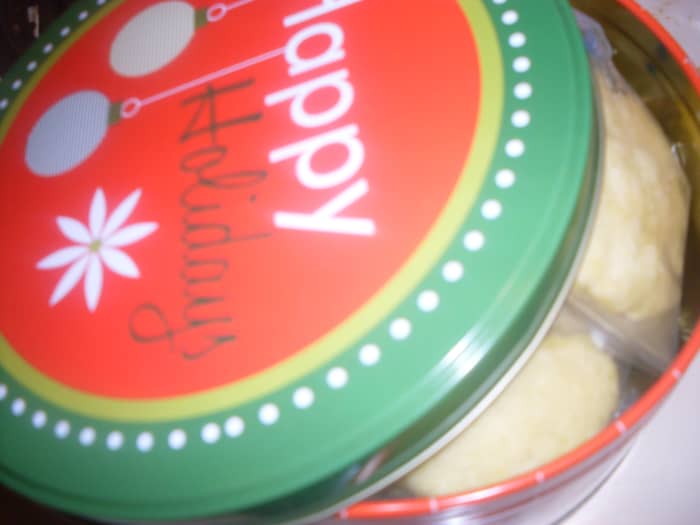 These gluten free sugar cookies were baked using a Betty Crocker mix. Some of the gluten free sugar cookies were packed in a cute red and green Holiday tin for sharing.