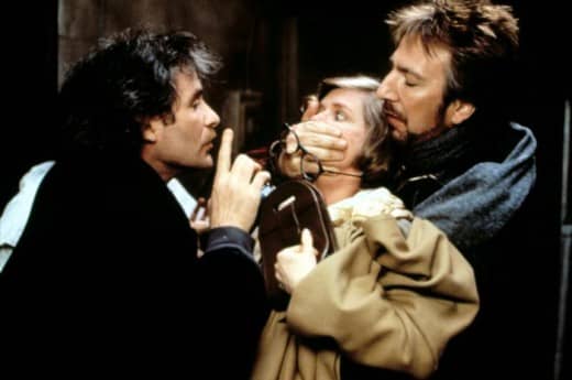 Kevin Kline (left) and Alan Rickman (right) silence local film critic who doesn't understand if the movie is trying to be funny or scary.