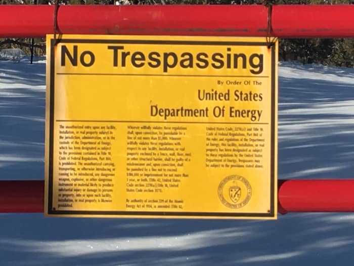 Warning signs at the perimeter fence of the National Laboratories in Los Alamos, New Mexico. You will see numerous signs like these on your way to Bandelier.