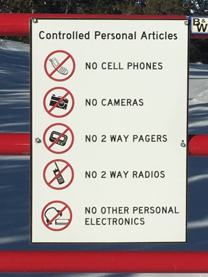 Warning signs at the perimeter fence of the National Laboratories in Los Alamos, New Mexico. You will see numerous signs like these on your way to Bandelier.