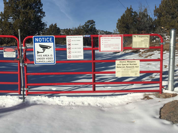 Warning signs at the perimeter fence of the National Laboratories in Los Alamos, New Mexico. You will see numerous signs like these on your way to Bandelier.