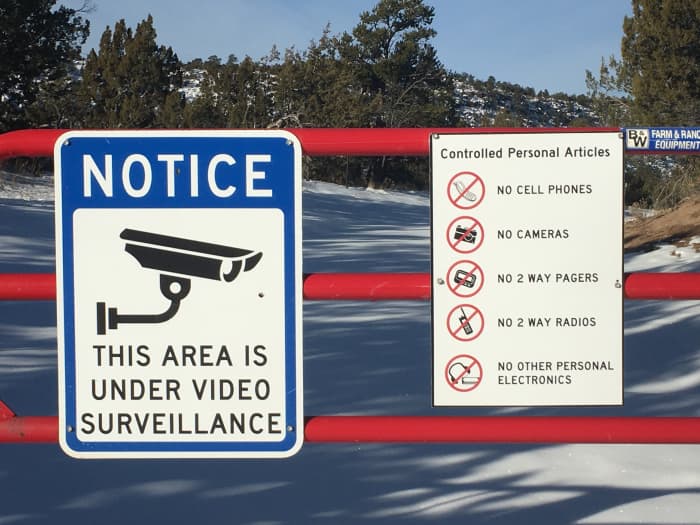 Warning signs at the perimeter fence of the National Laboratories in Los Alamos, New Mexico. You will see numerous signs like these on your way to Bandelier.