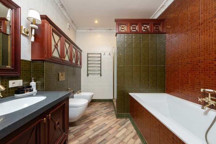 The Goat does well to have a mix of patterns in their decor. Try wooden floors, stylish wood trimming, and tile for the bathroom. The contrast of green with red will be delightful. I would pick a more red than the color here, which is somewhat brown.