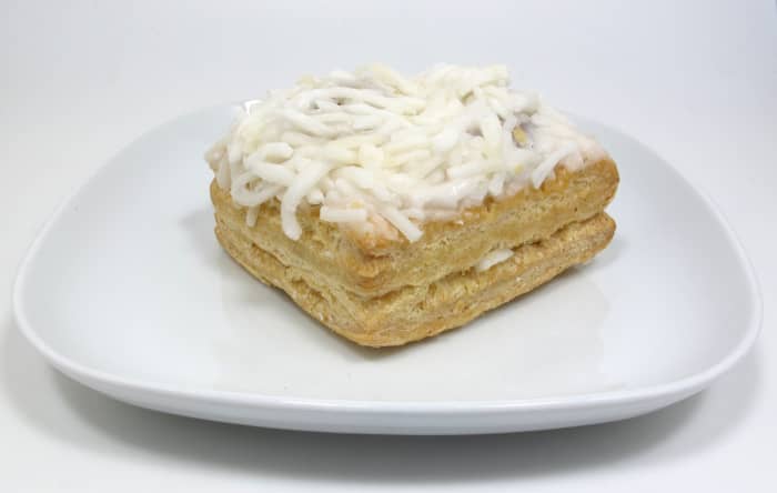 The shredded coconut on top resembles grated cheese; hence the name London cheesecake.