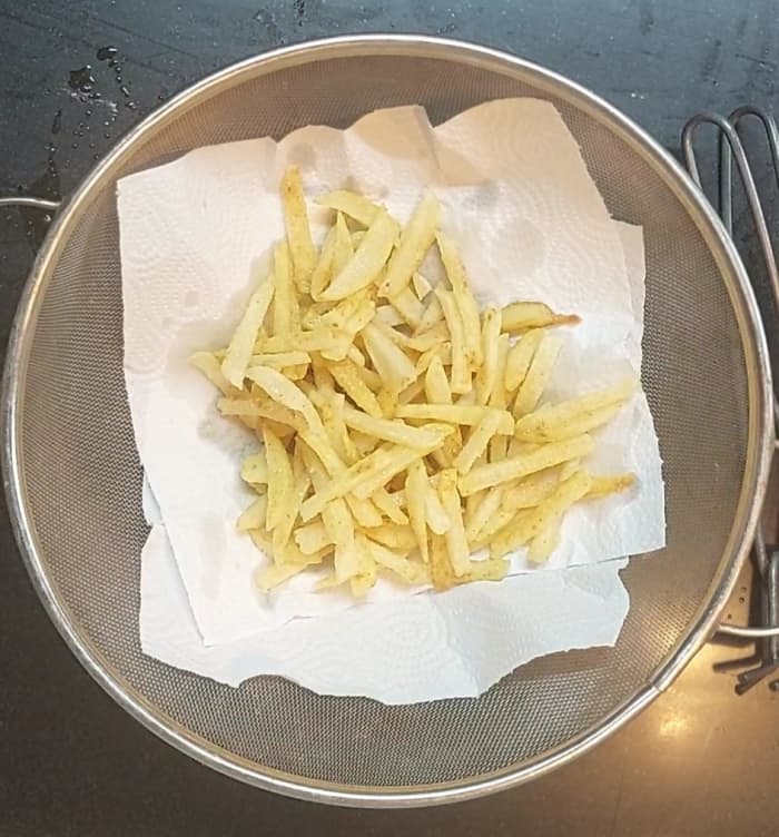Fry over medium flame till the potatoes turn golden brown and crisp (may take around 4-5 minutes). Transfer fried potatoes to a plate.