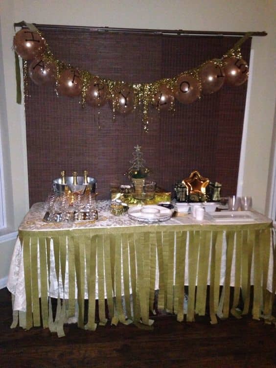 Use streamers from dollar tree to make a table skirt. Cut strips and tape two main strip of streamer and tape to table. Appetizer utensils, plates, napkins from dollar tree.