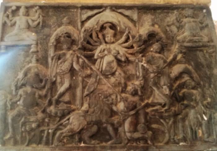 Goddess Lakshmi in a Durga panel standing on the right side of Goddess Durga; stone work; Radha krishna temple; Jagadanandapur, Purva Bardhaman district.