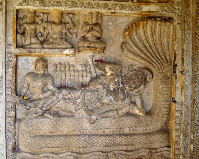 Goddess Lakshmi as a consort of Lord Vishnu who is lying on Shesha Naga; stucco work; Radheshyam temple, Vishnupur, district Bankura.